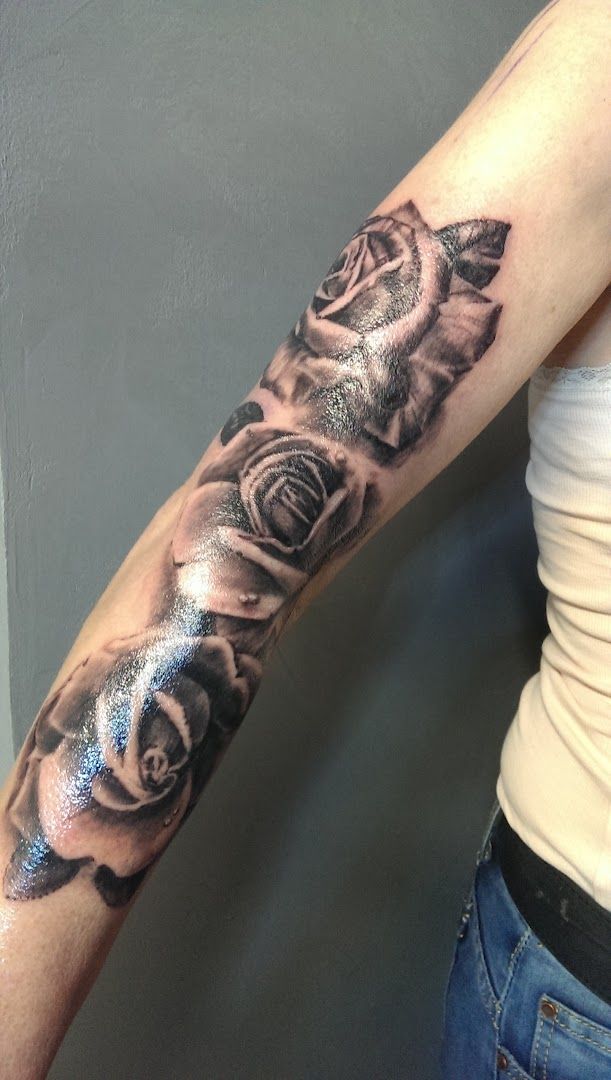 a woman's arm with a black and grey cover-up tattoo, sigmaringen, germany