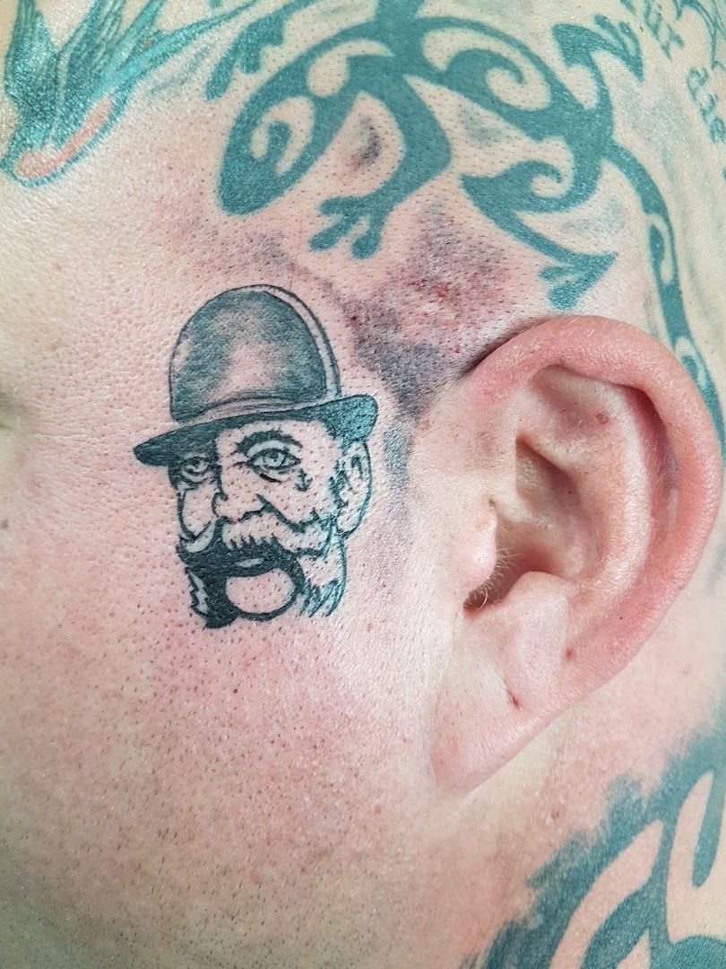 a man with a cover-up tattoo on his head, ravensburg, germany