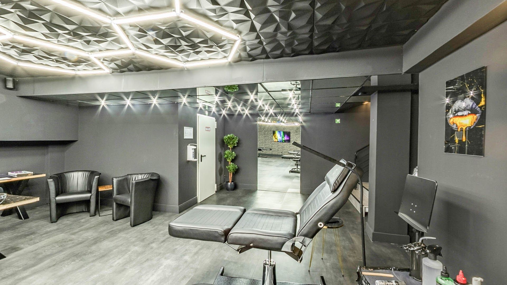 a salon with a large mirror and a chair