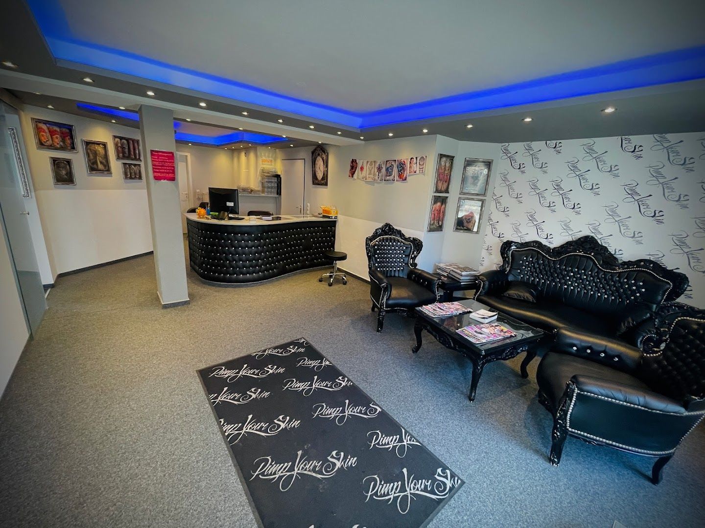 a room with black couches and a black table