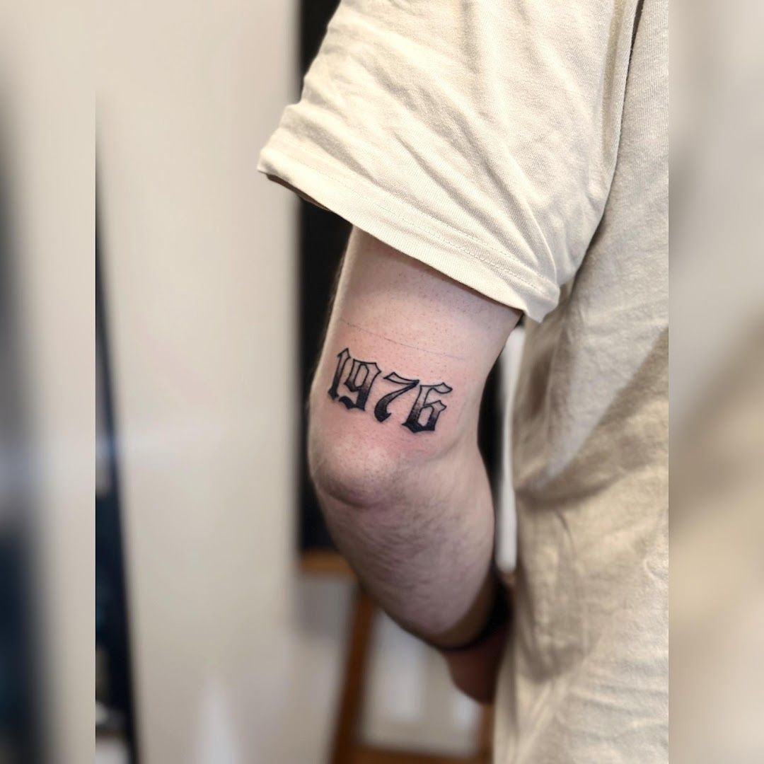 a man with a small narben tattoo on his arm, ammerland, germany