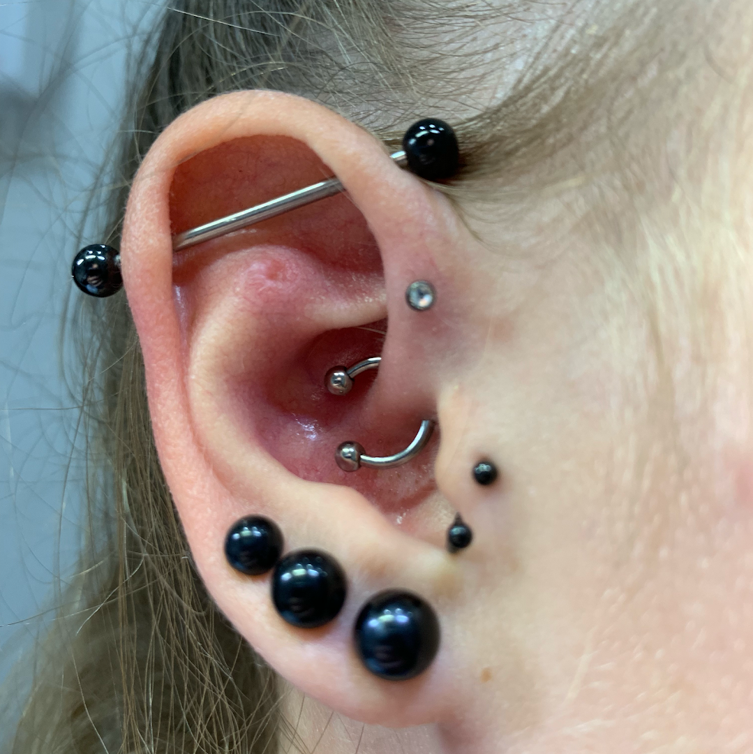 a woman with a piercing on her ear