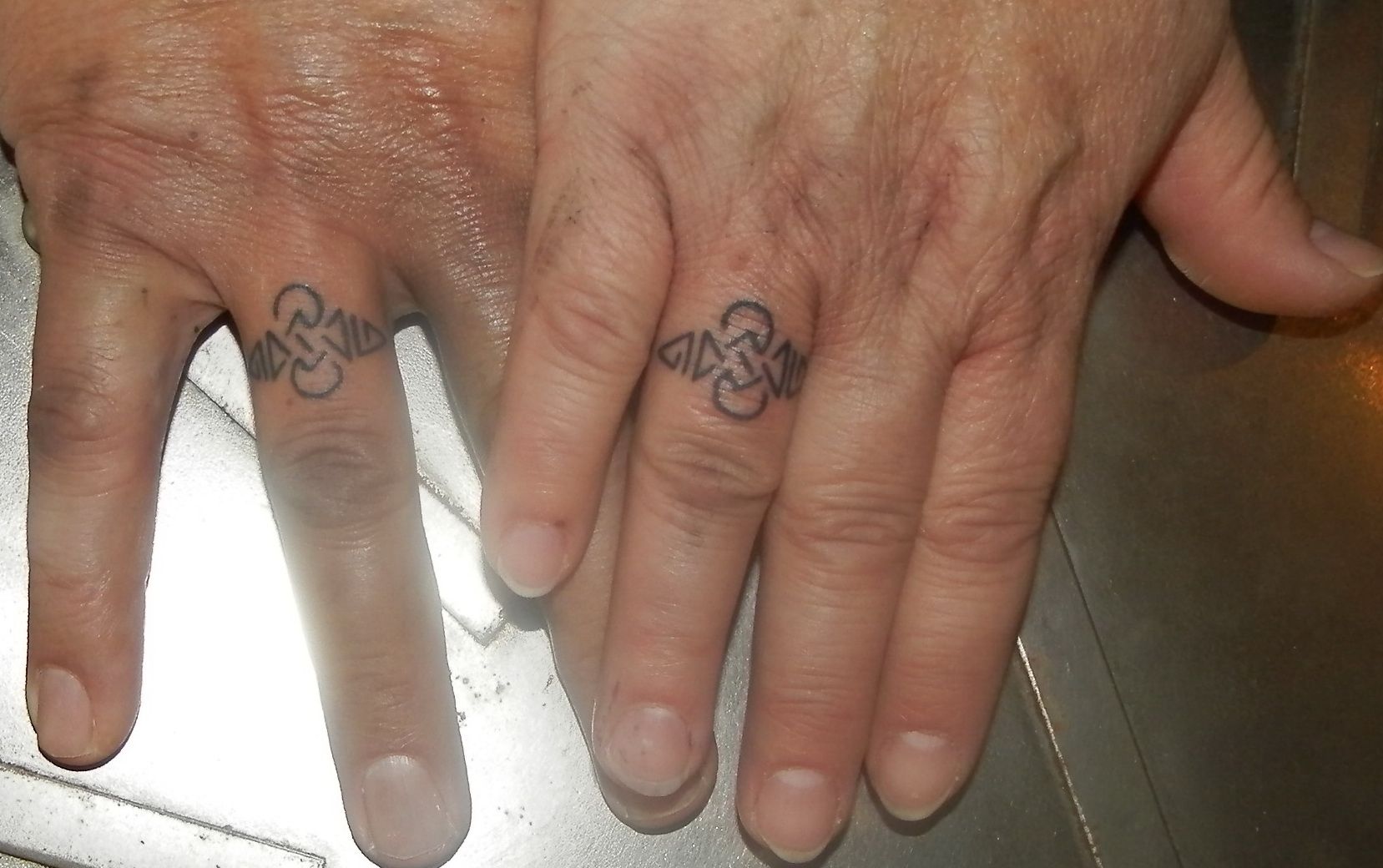 two hands with narben tattoos on them, bodenseekreis, germany