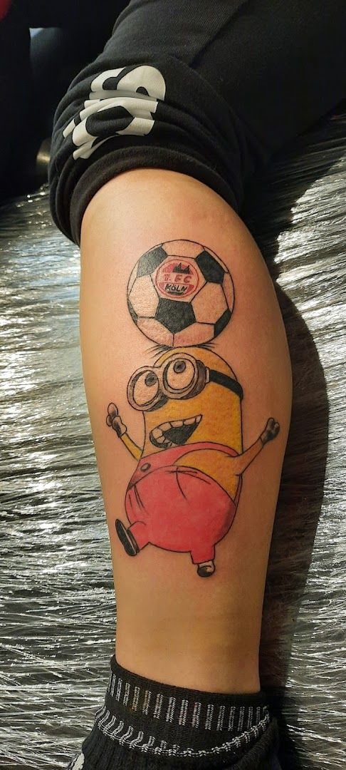 a cover-up tattoo of a cartoon character on the leg, neu-ulm, germany