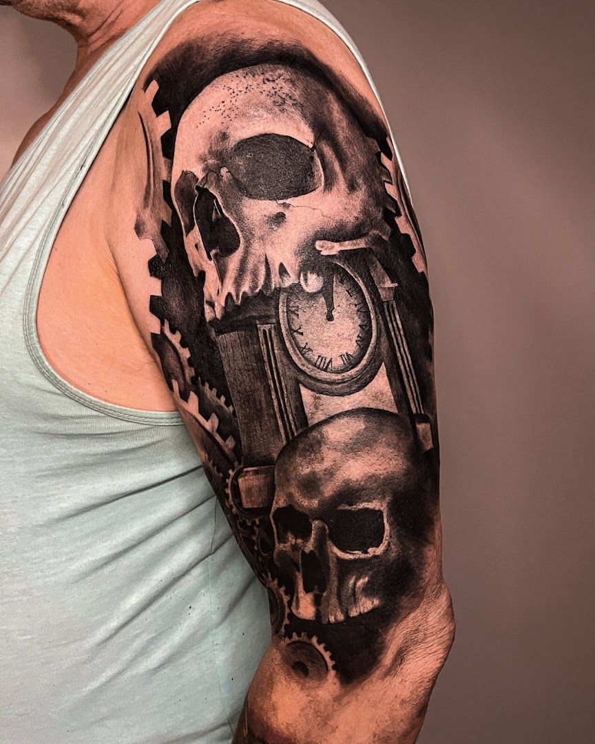 a man with a clock and skull cover-up tattoo on his arm, bochum, germany