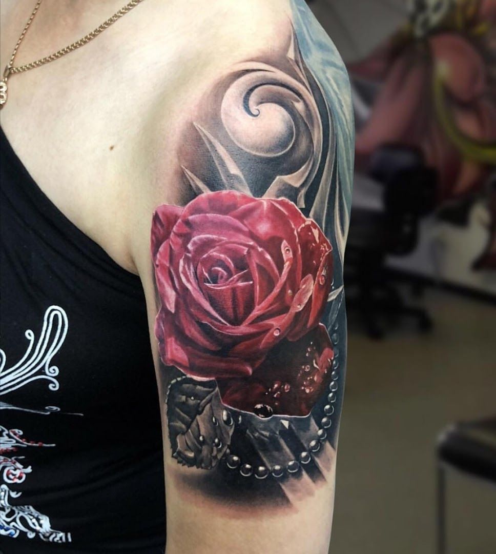 a rose cover-up tattoo on the arm, berlin, germany