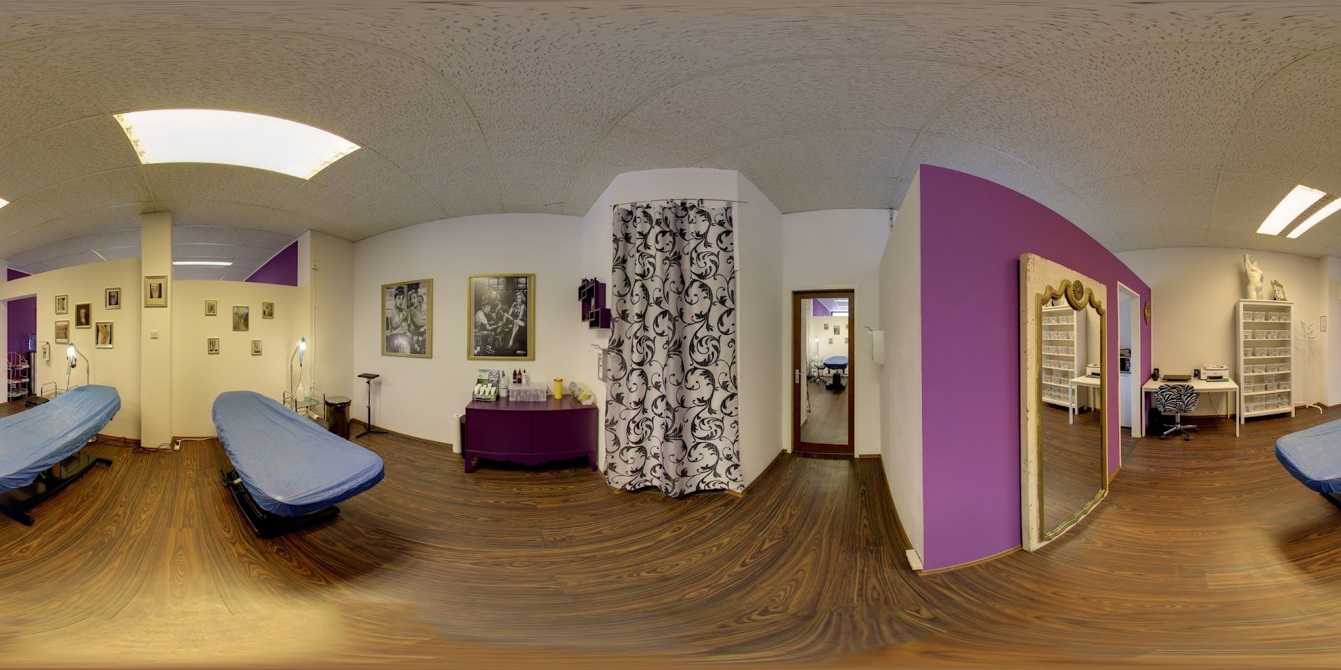 a room with a mirror and a bed