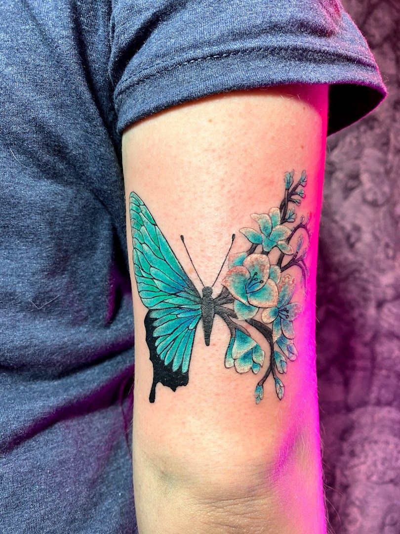 a blue butterfly tribal tattoo on the arm, rhein-neckar-kreis, germany