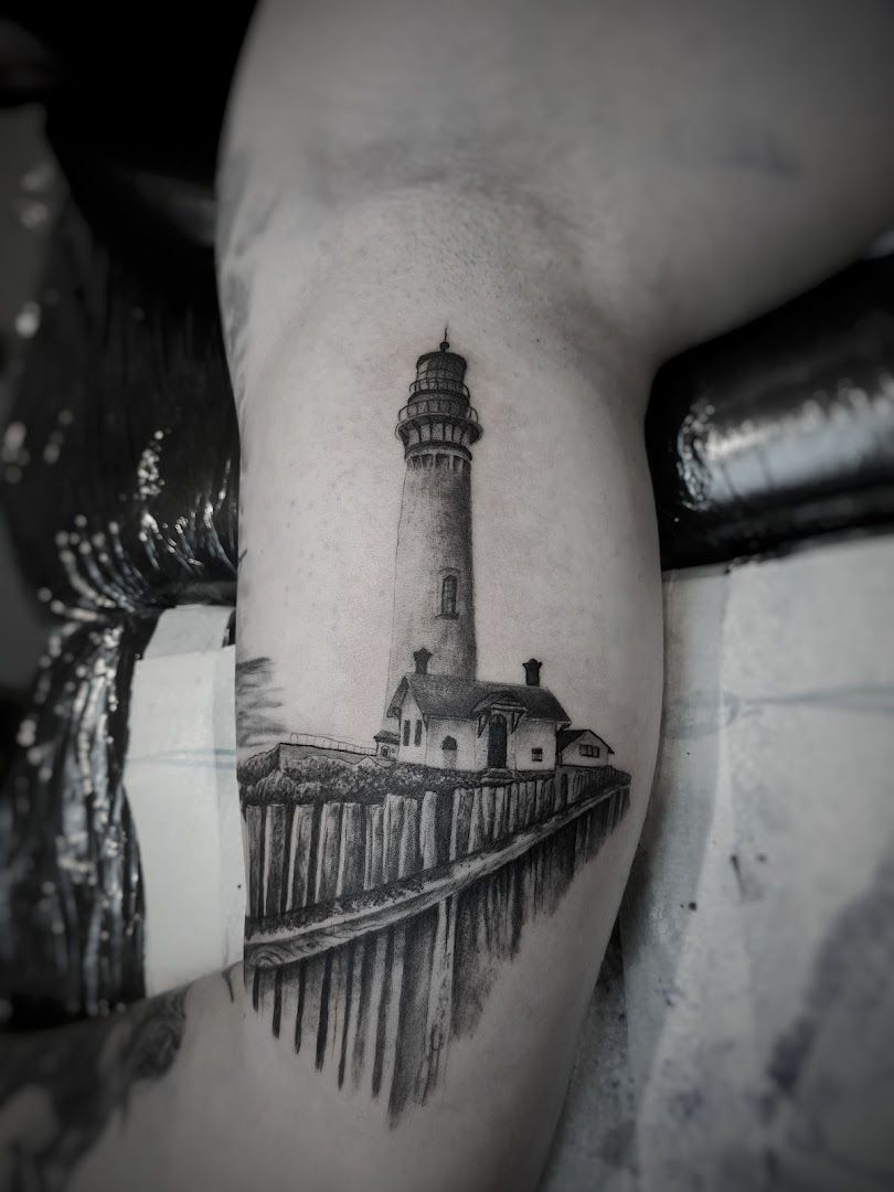 a lighthouse cover-up tattoo on the arm, kreisfreie stadt braunschweig, germany