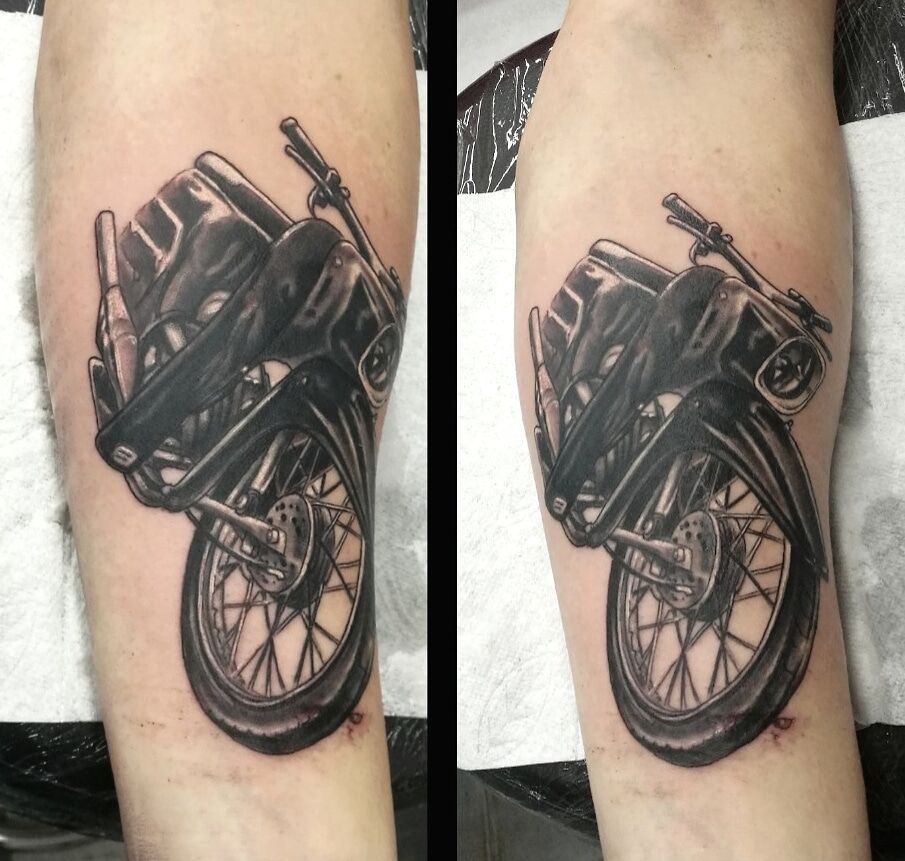 a black and white cover-up tattoo of a motorcycle, barnim, germany