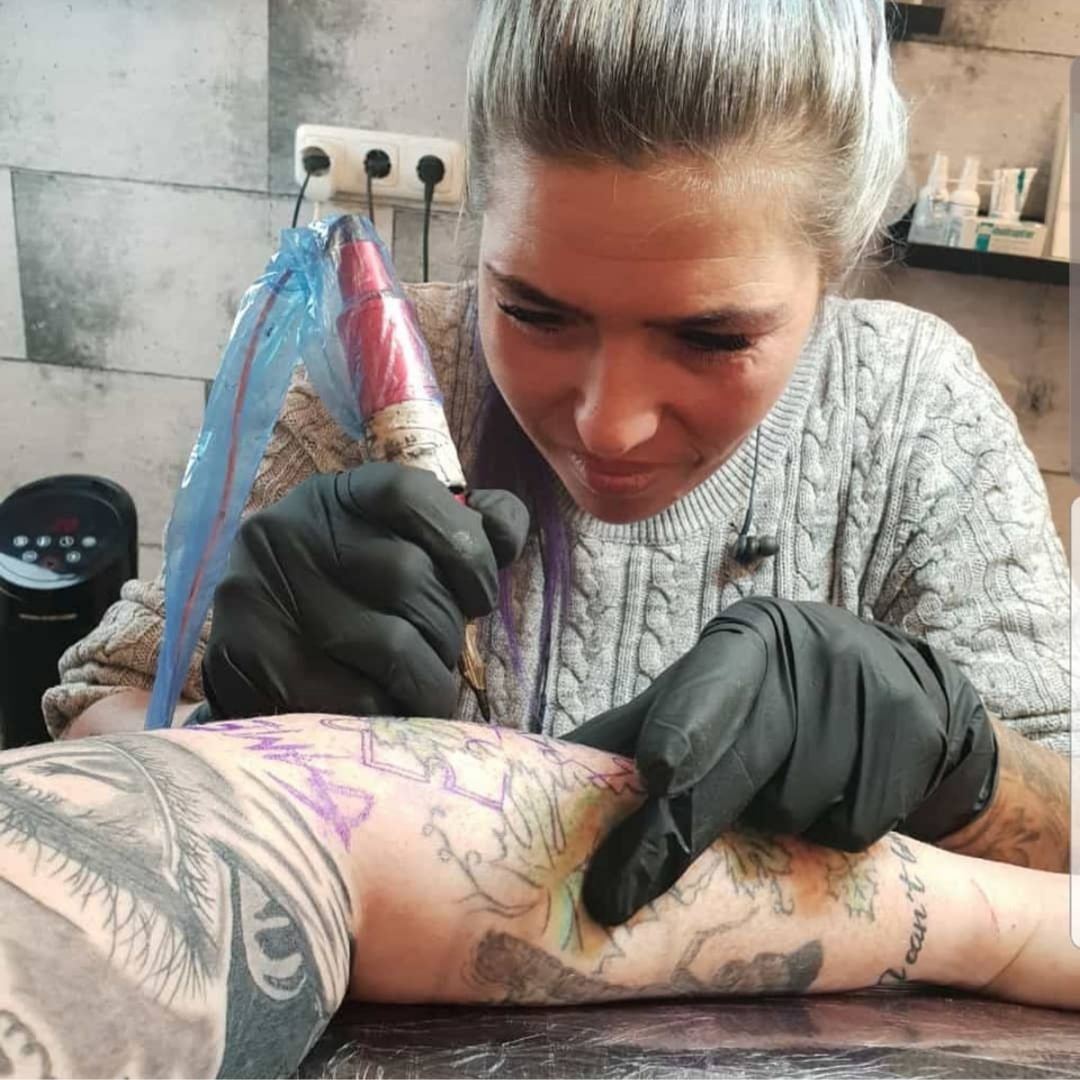 a woman with narben tattoos on her arm, rheinisch-bergischer kreis, germany