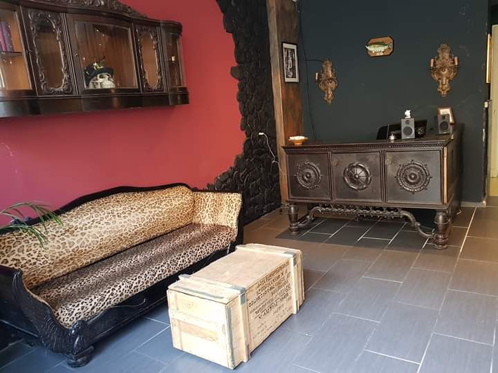 a living room with a couch and a leopard print couch