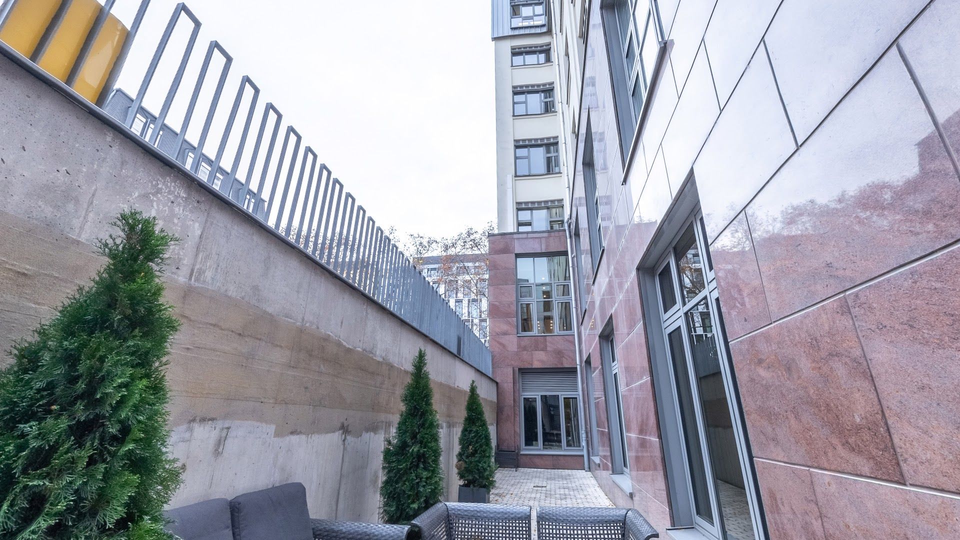 a balcony with a couch and a table