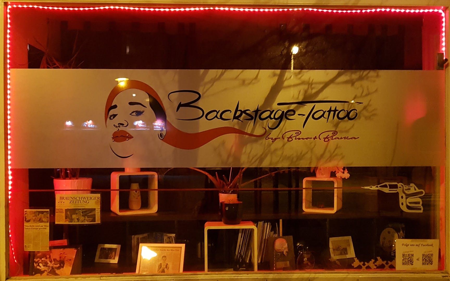 a store window with a sign and a picture of a woman