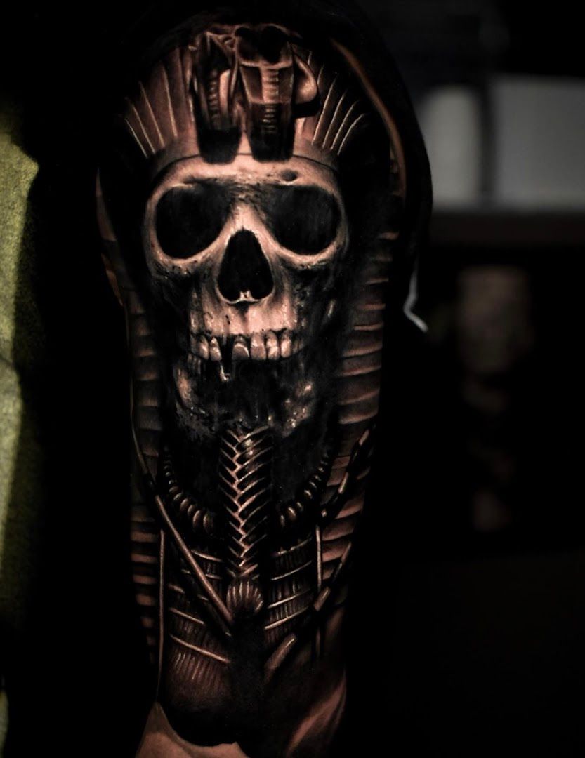 a skull with a dagger on the arm