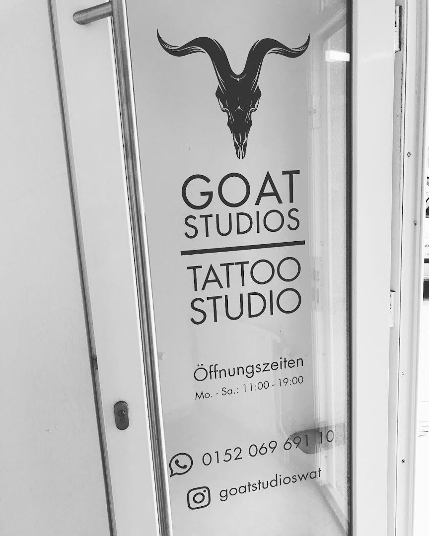 a white door with a goat head on it