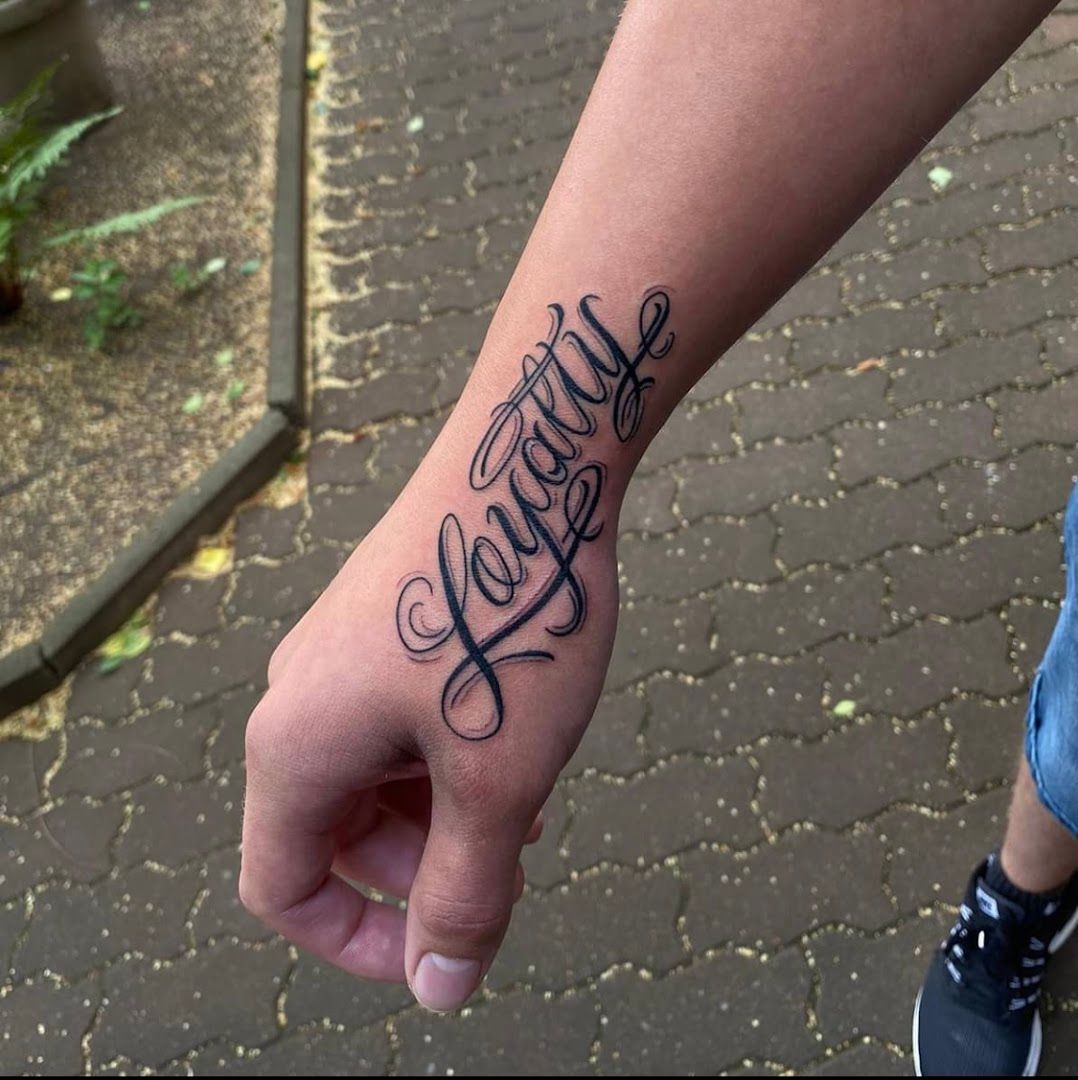 a cover-up tattoo with the word love on it, sächsische schweiz-osterzgebirge, germany