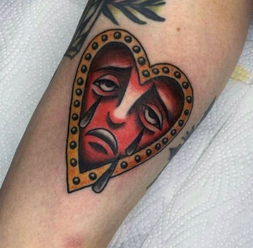 a heart with a mask on it