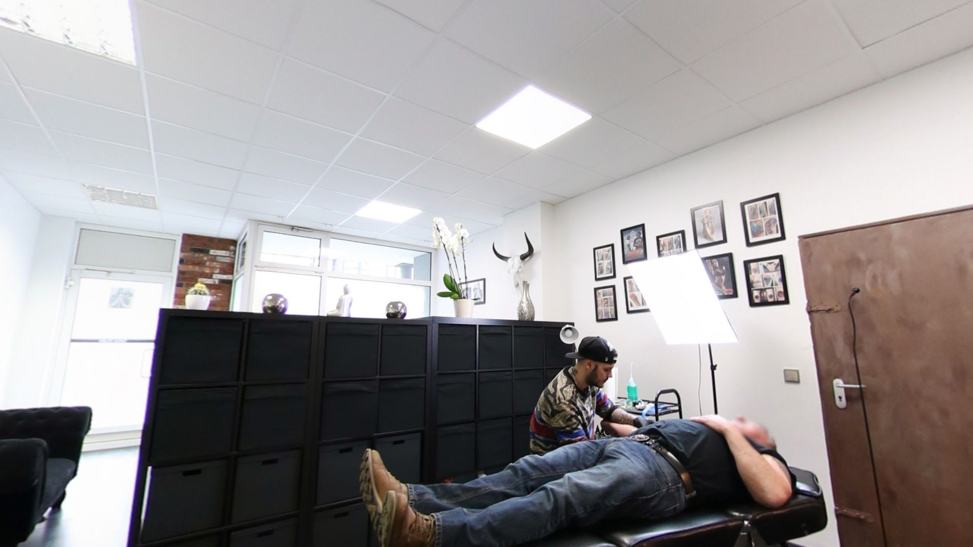 a man is sitting in a chair in an office