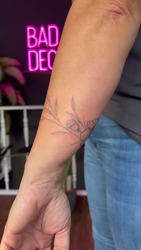 a woman's wrist cover-up tattoo with a small bird on it, hamburg, germany