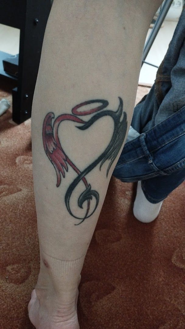 a cover-up tattoo of a snake on the leg, nürnberg, germany