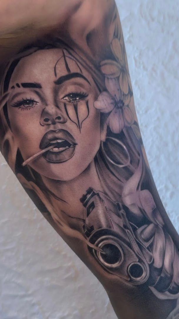 a woman with a cigarette narben tattoo on her leg, biberach, germany