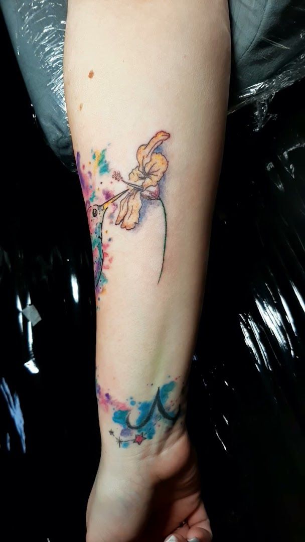 a watercolor narben tattoo on the arm, märkischer kreis, germany