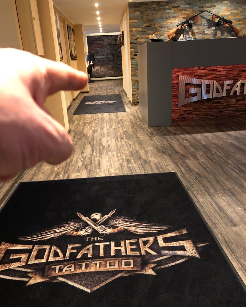 the godfather logo on a black rug