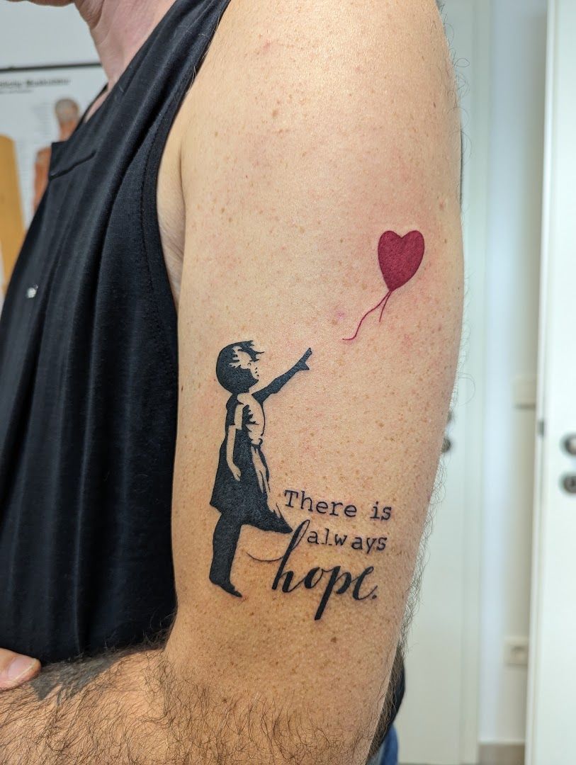 a man with a narben tattoo on his arm, stuttgart, germany