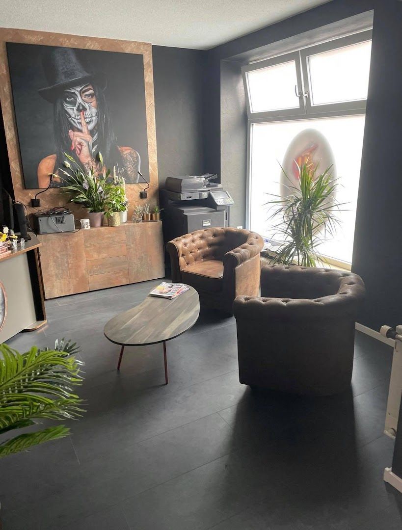 a living room with a large painting on the wall