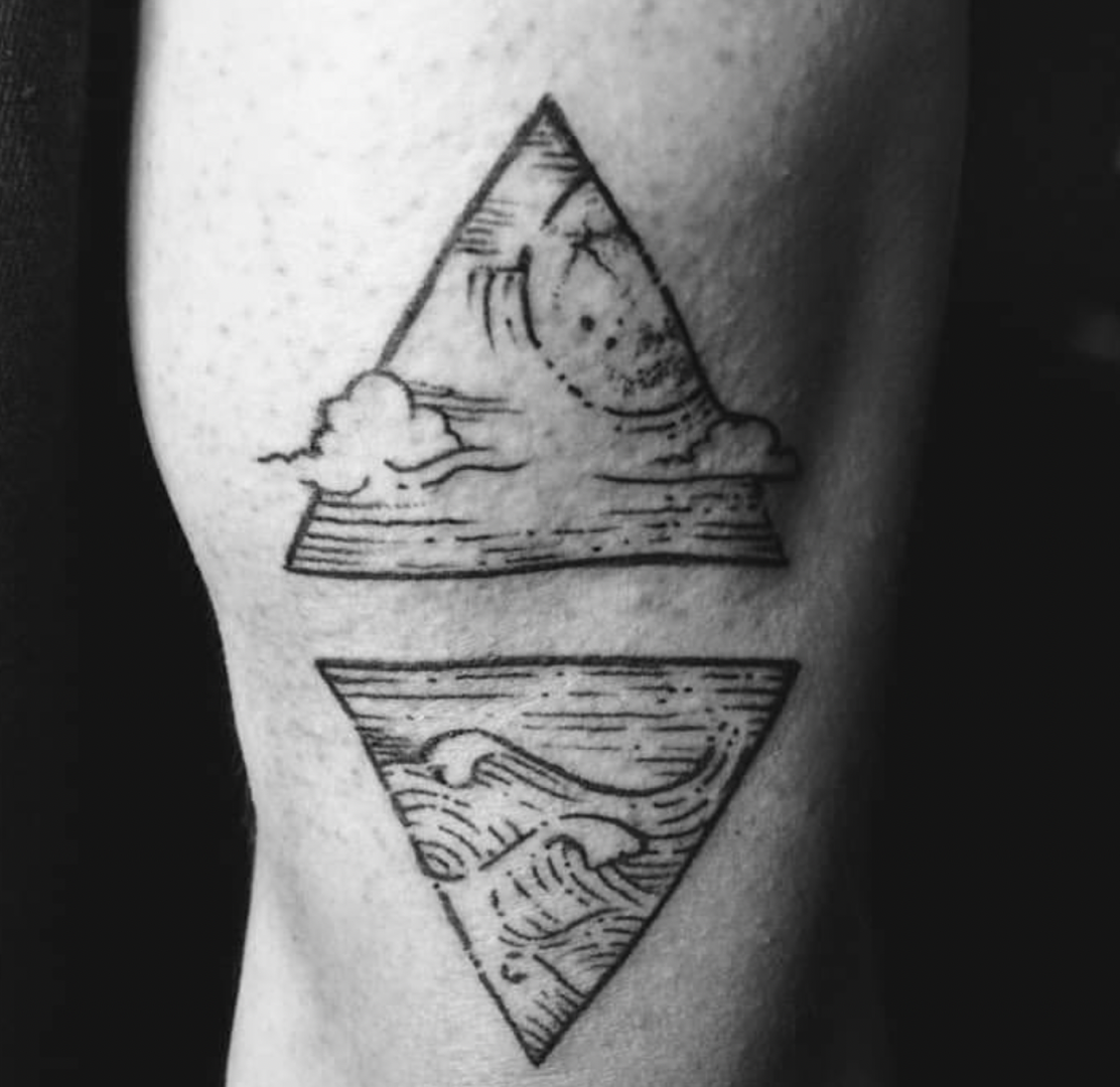 a black and white cover-up tattoo of a mountain and a lake, berlin, germany