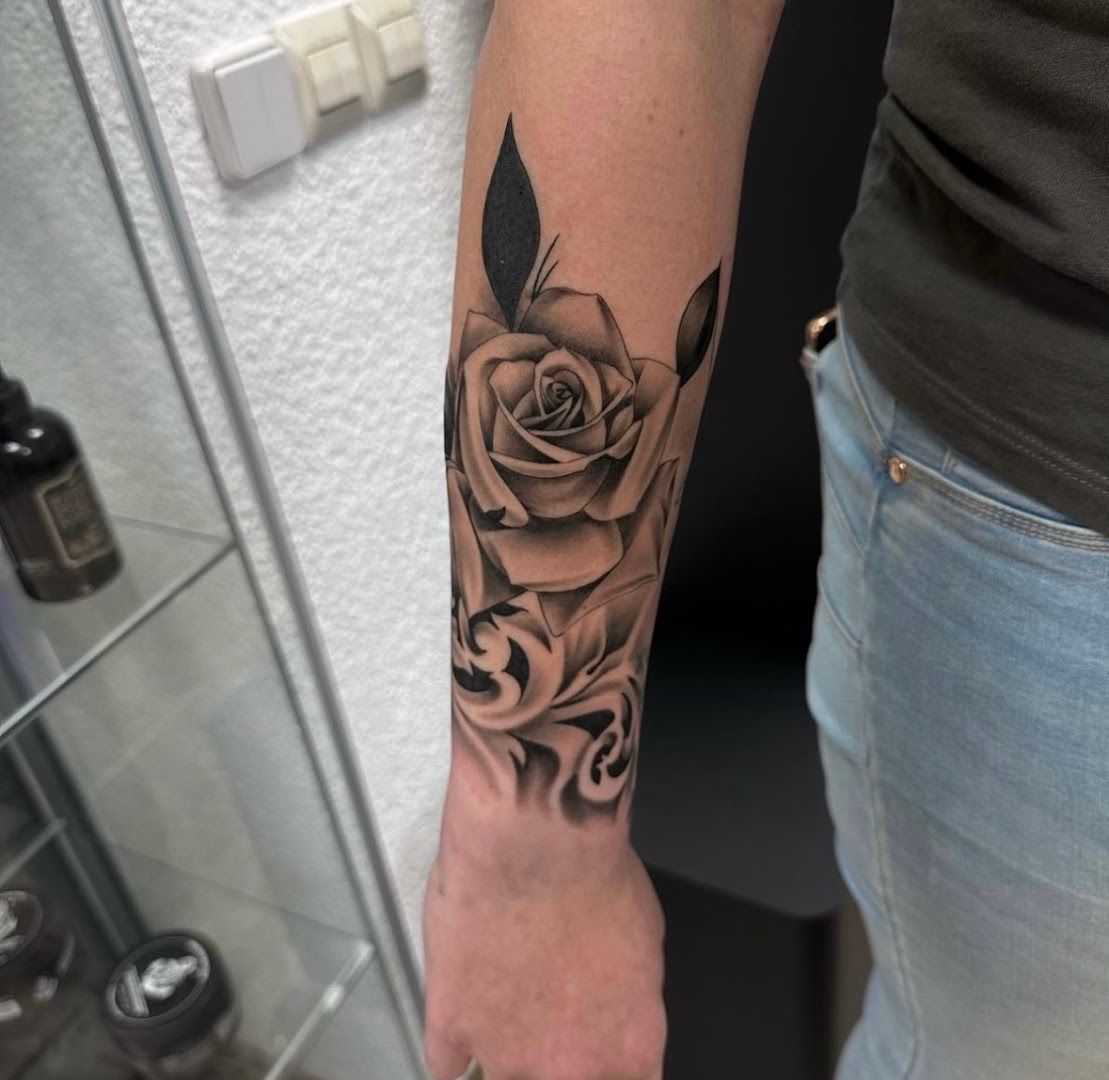 a black and white rose cover-up tattoo on the forearm, sächsische schweiz-osterzgebirge, germany