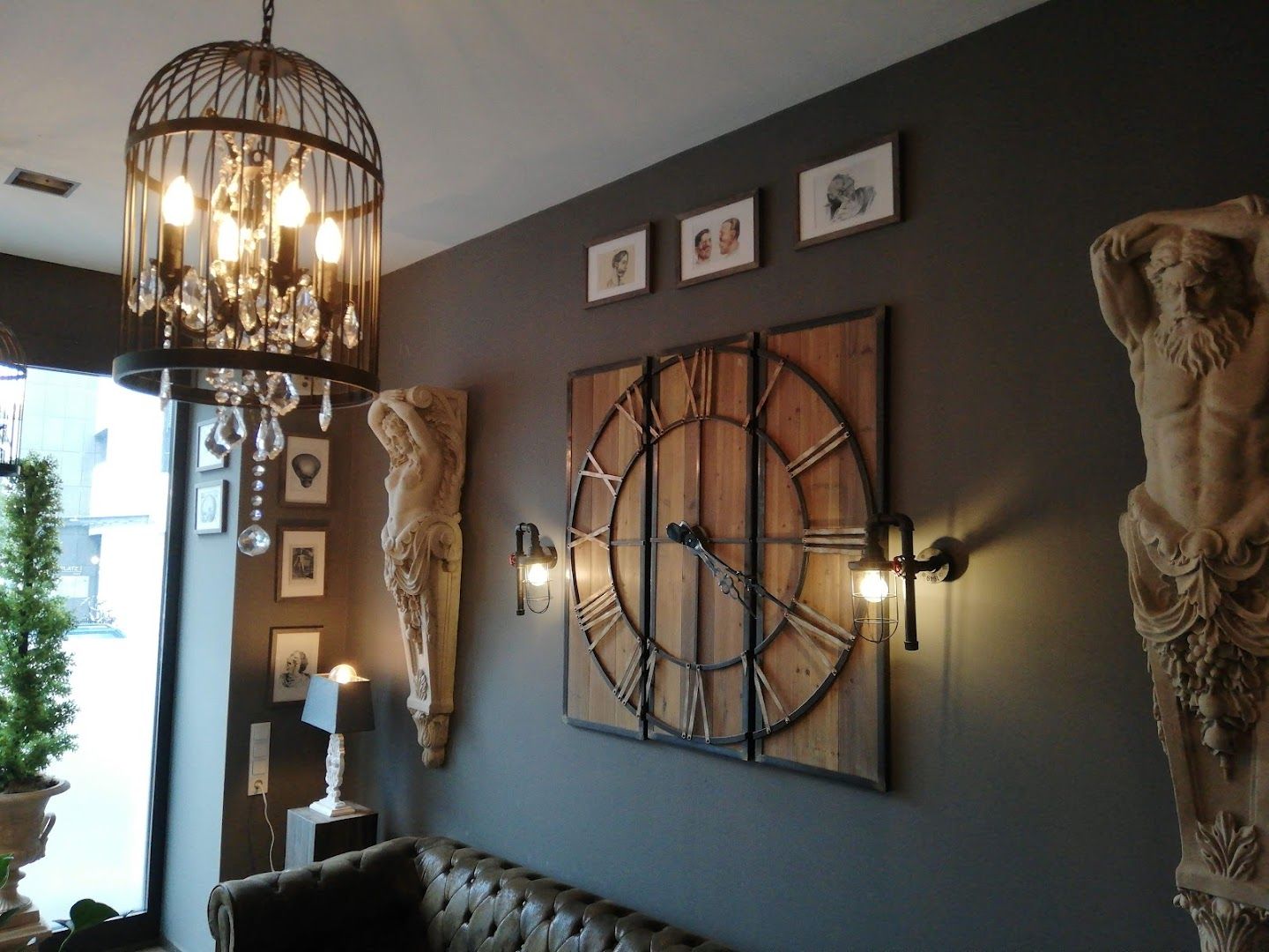 a living room with a couch and a clock