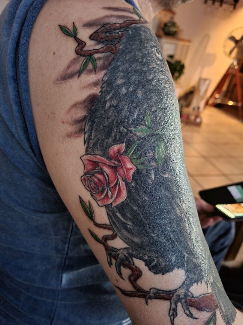 a japanische tattoos in leipzig with a bird and roses on it, rheinisch-bergischer kreis, germany