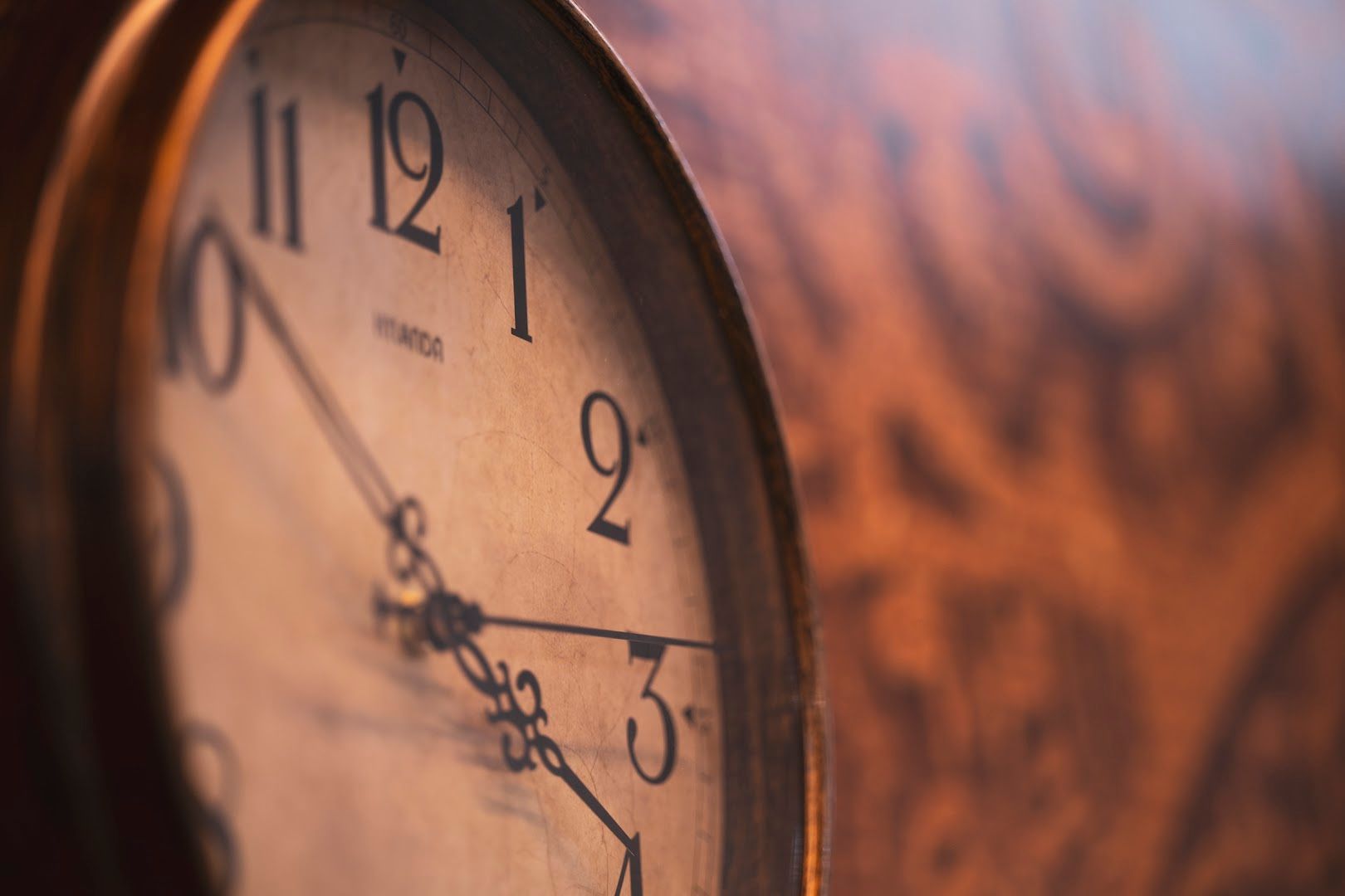 a clock with a brown face