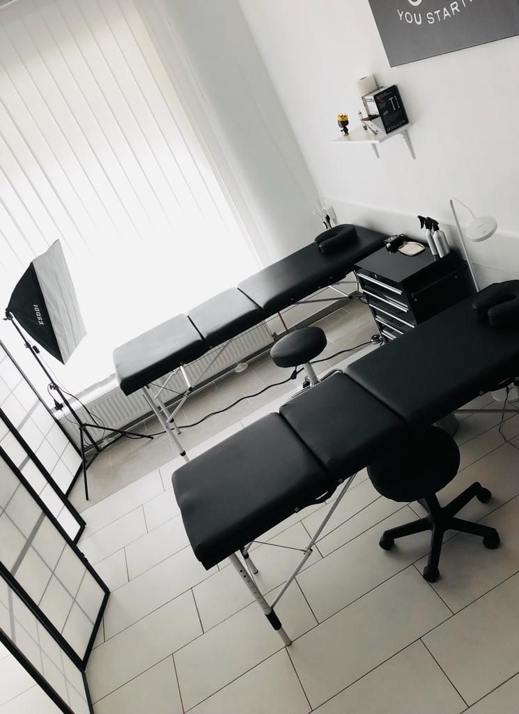 a black and white office with a desk and chair