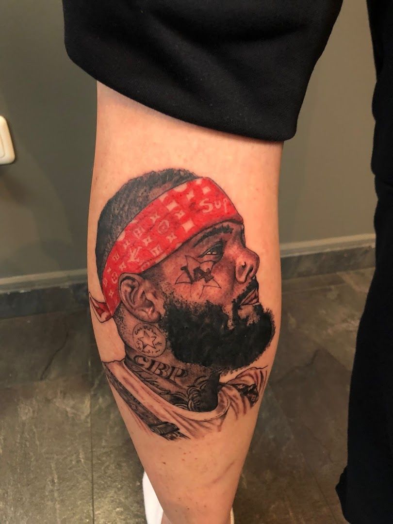 a cover-up tattoo of a bearded man with a beard and a banda on his arm, aschaffenburg, germany