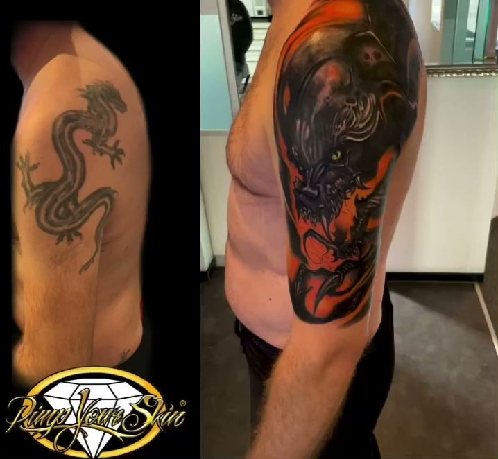 a man with a dragon cover-up tattoo on his arm, augsburg, germany