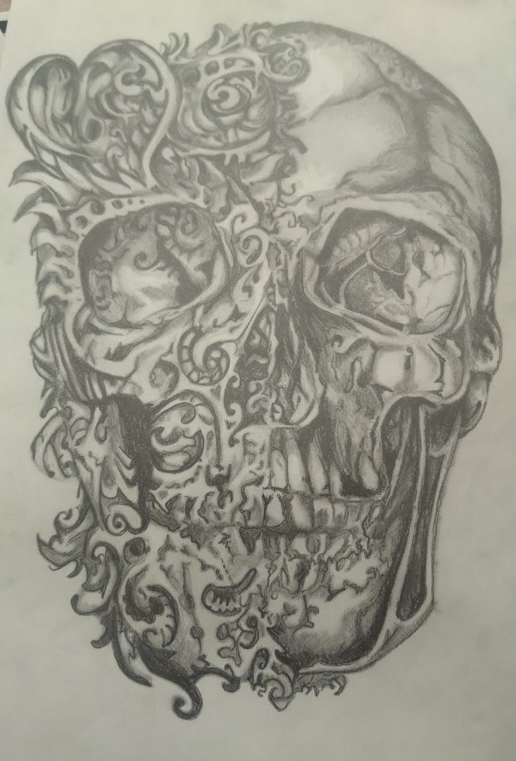a skull with roses and skulls on it