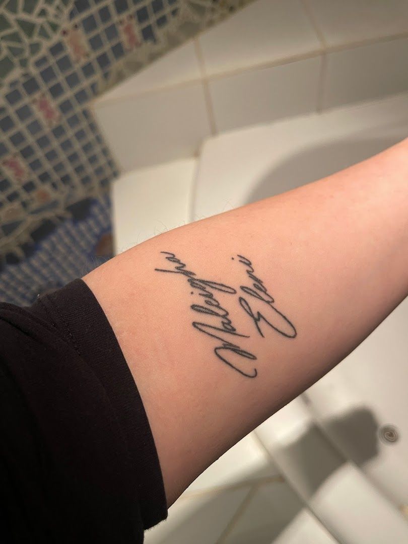 a narben tattoo with the words love and a heart, wetteraukreis, germany