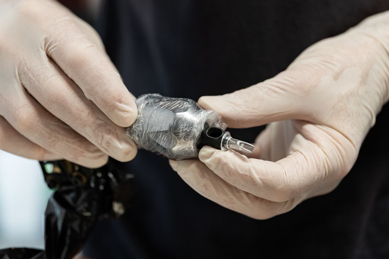 a person is holding a piece of metal