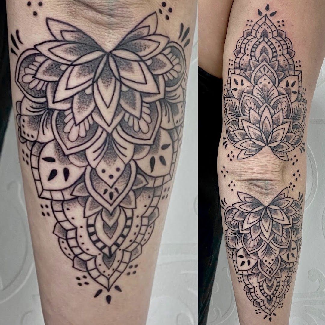 a black and white cover-up tattoo of a lotus flower, waldshut, germany