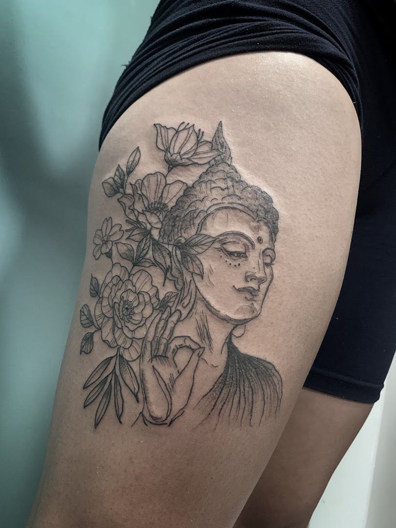 a woman with a flower cover-up tattoo on her thigh, berlin, germany