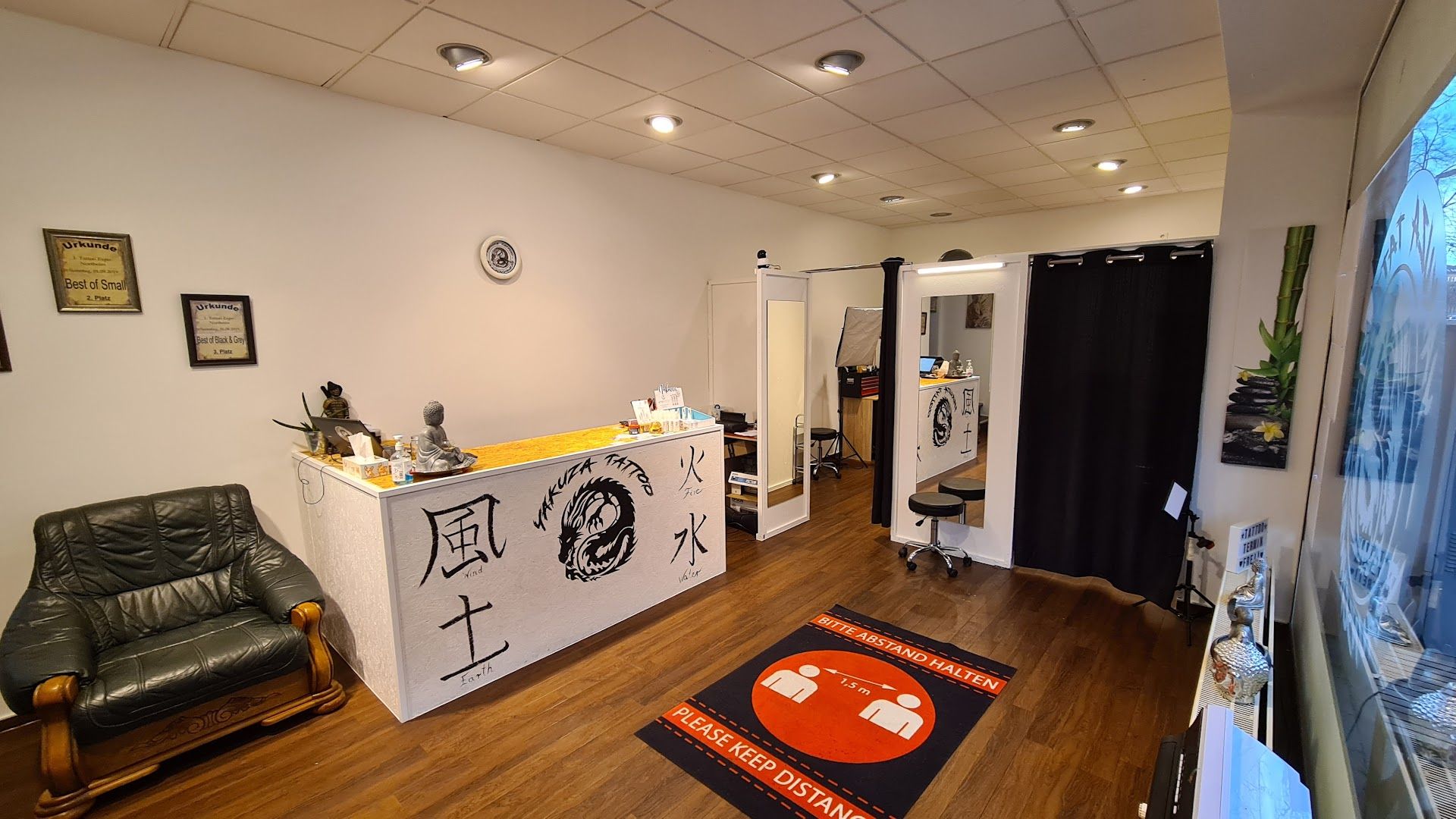 a room with a black and white sign and a black chair