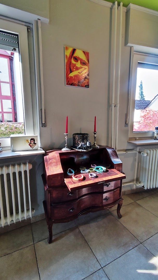 a small desk in a room with a window