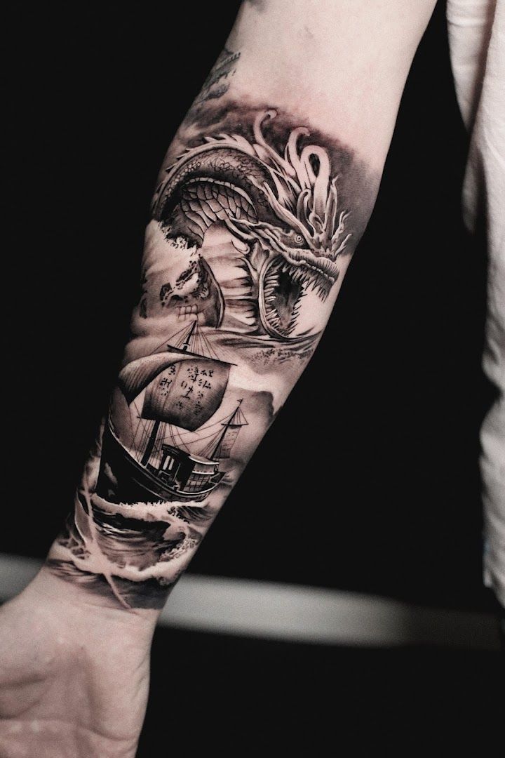 a black and white cover-up tattoo of a dragon on the arm, pinneberg, germany