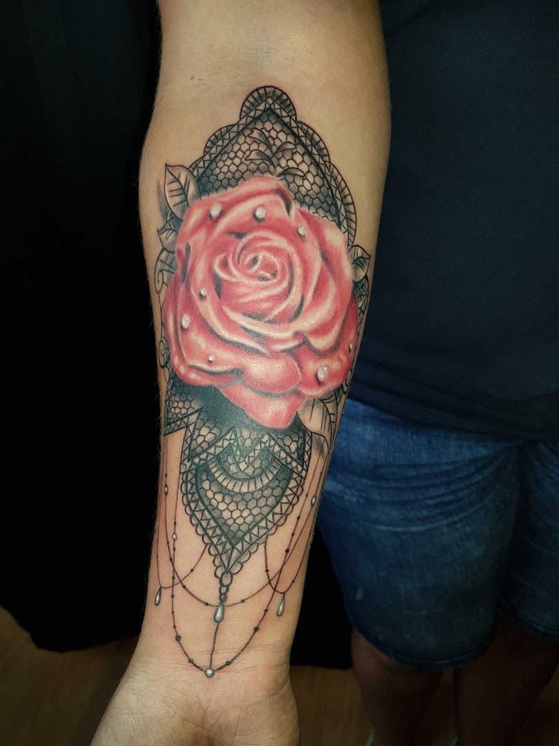 a rose cover-up tattoo on the arm, gütersloh, germany