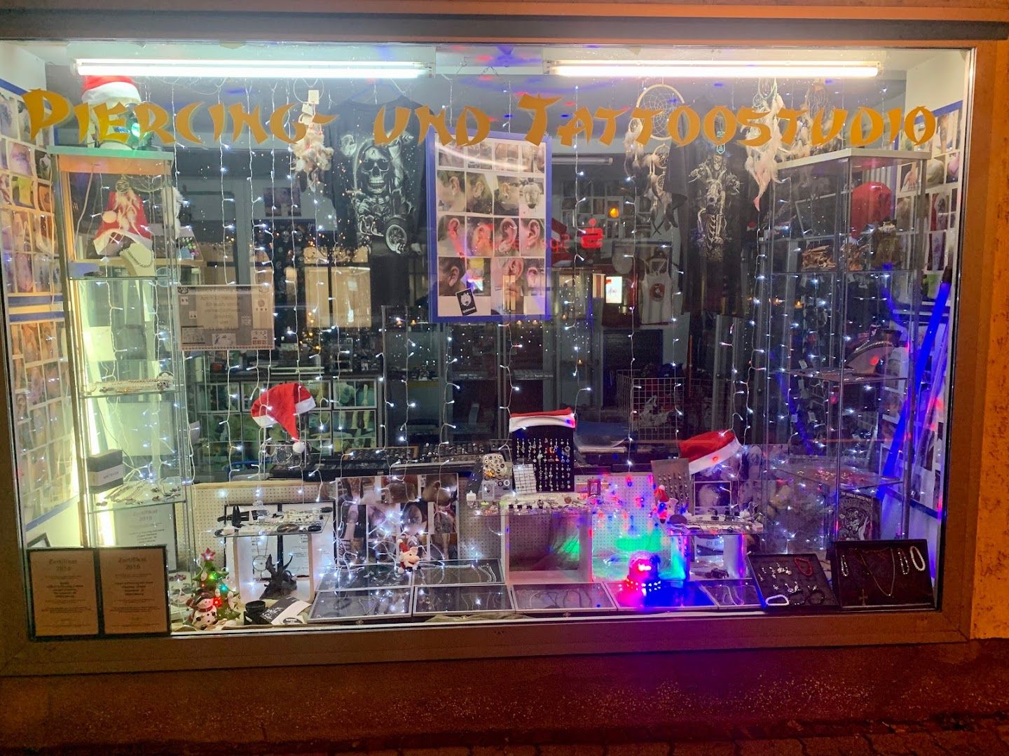 a window display with a christmas tree in it