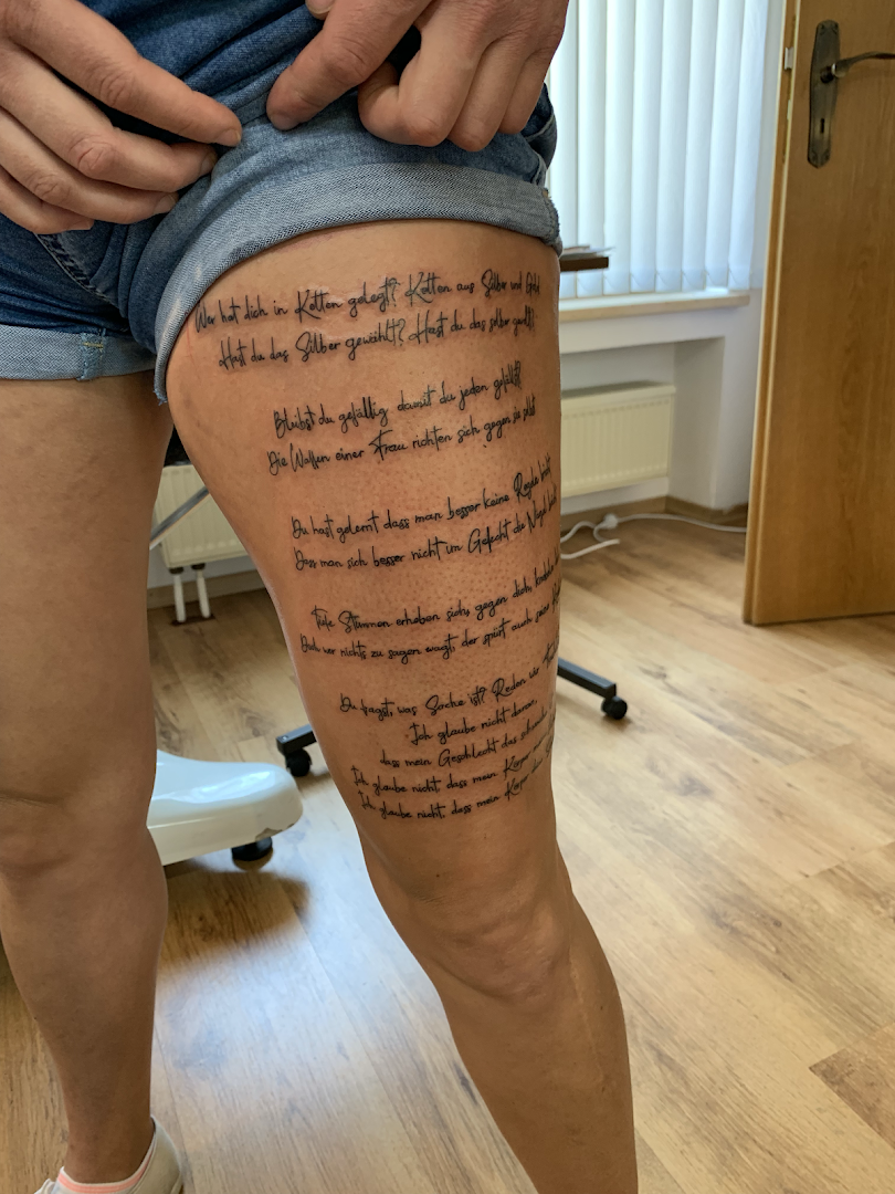 a man with a portrait tattoos on his thigh, neuburg-schrobenhausen, germany