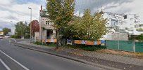 a street with a fence and trees